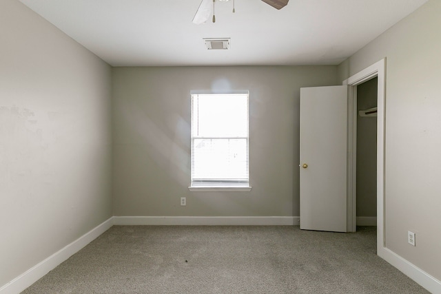 unfurnished bedroom with light colored carpet