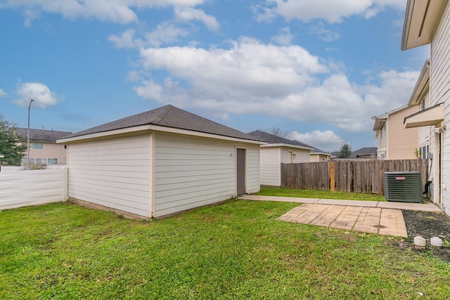 view of yard featuring a patio and central air condition unit