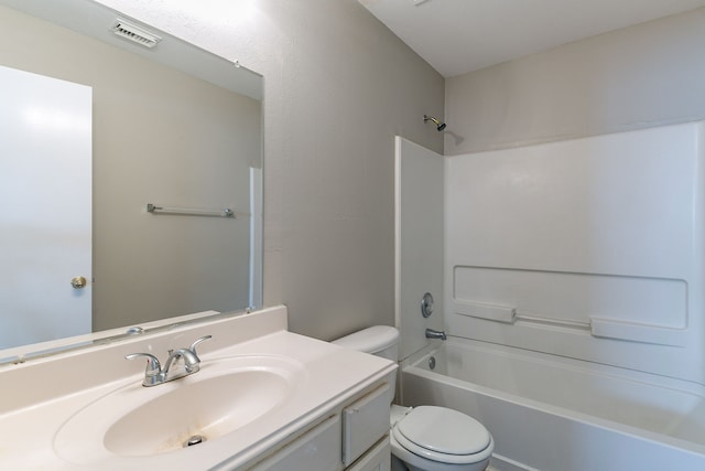 full bathroom with vanity, bathtub / shower combination, and toilet