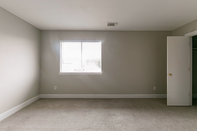 unfurnished room with carpet floors