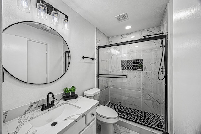 full bath with marble finish floor, a textured wall, a stall shower, a textured ceiling, and vanity