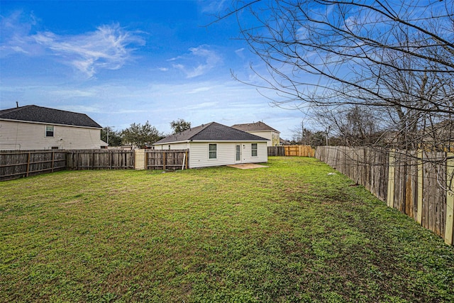 view of yard featuring a fenced backyard