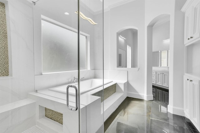 bathroom featuring vanity, ornamental molding, and independent shower and bath