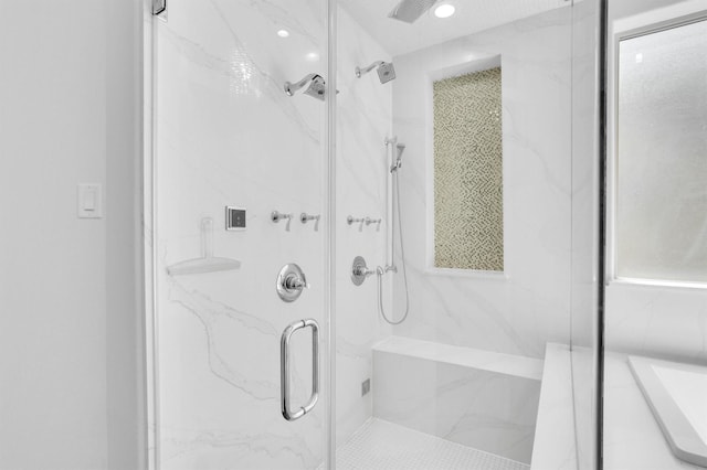 bathroom with a shower with shower door