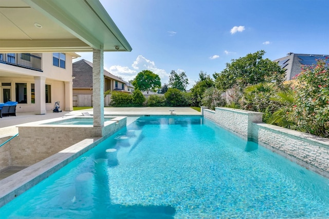 view of pool featuring an in ground hot tub and a patio area