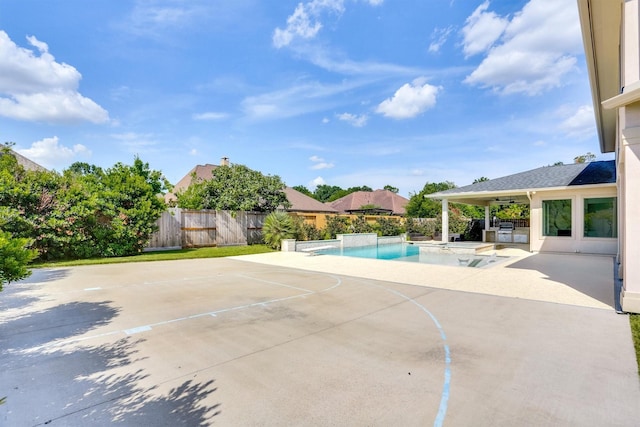 view of swimming pool with basketball court