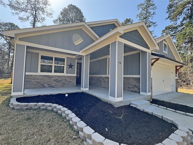 view of front of house with a garage and a porch