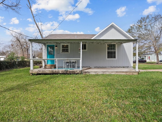 view of front of home with a front yard and covered porch