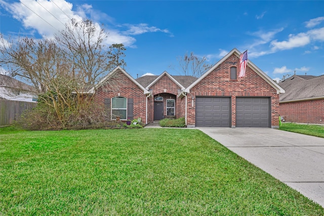 view of front of house featuring a garage and a front yard