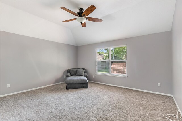 unfurnished room with baseboards, carpet flooring, vaulted ceiling, and a ceiling fan