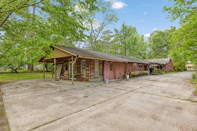 view of property exterior with driveway