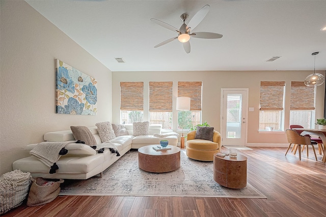 living room with hardwood / wood-style flooring and ceiling fan