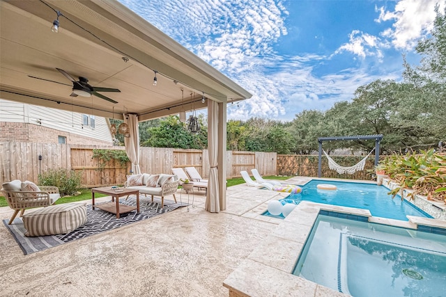 view of pool featuring outdoor lounge area, a patio, and ceiling fan