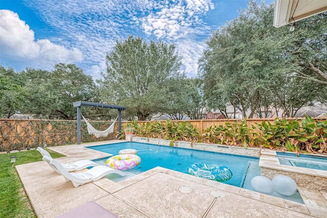 view of swimming pool with a patio