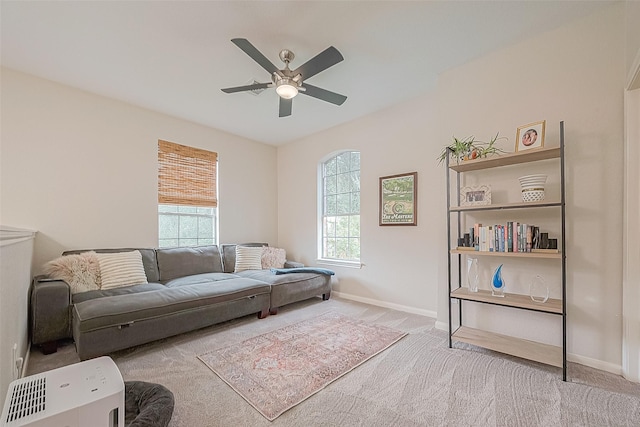 living room with ceiling fan and light carpet