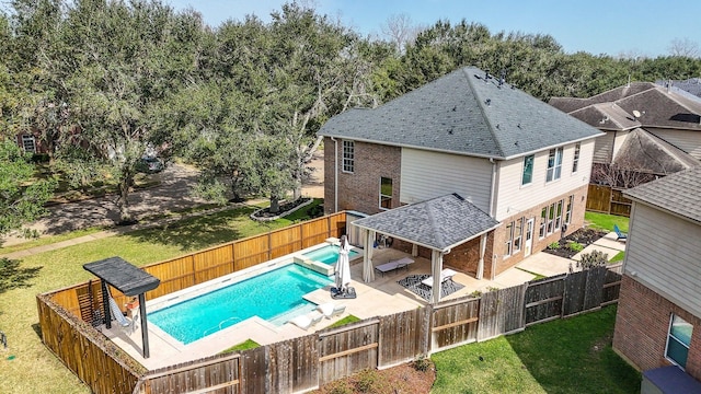 view of pool featuring a patio and a yard