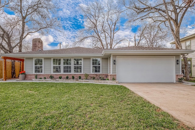 view of front of home with a garage and a front yard