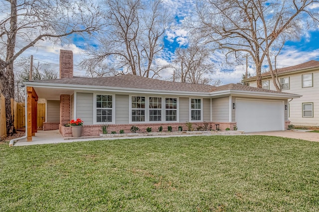 view of front of house featuring a garage and a front yard