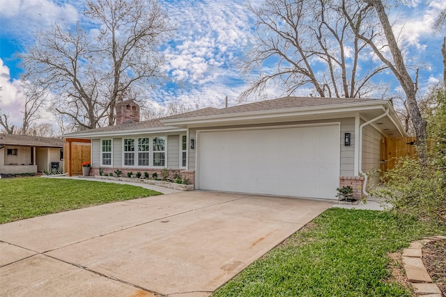 single story home with a garage and a front lawn