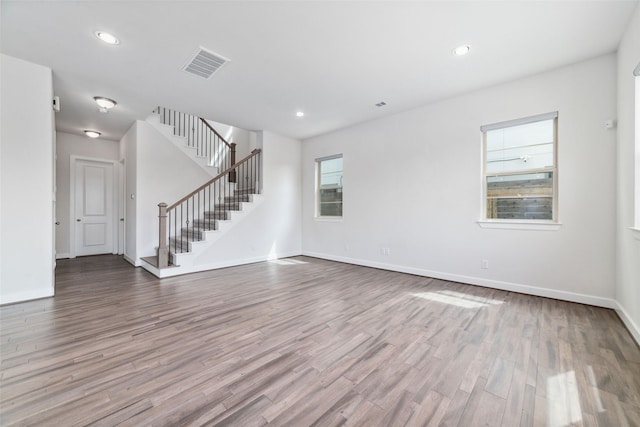 empty room with hardwood / wood-style flooring