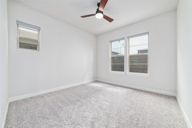 spare room featuring carpet floors and ceiling fan