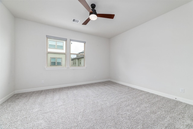 empty room with ceiling fan and carpet flooring