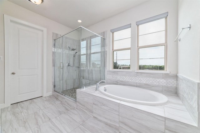 bathroom with shower with separate bathtub