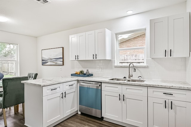 kitchen featuring dark wood-type flooring, sink, dishwasher, light stone countertops, and white cabinets