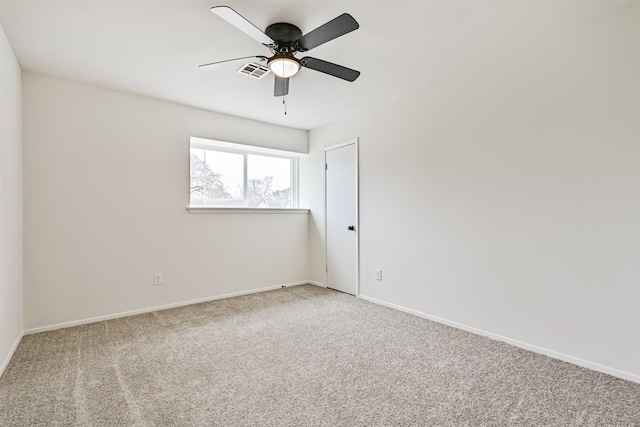 empty room featuring carpet flooring and ceiling fan