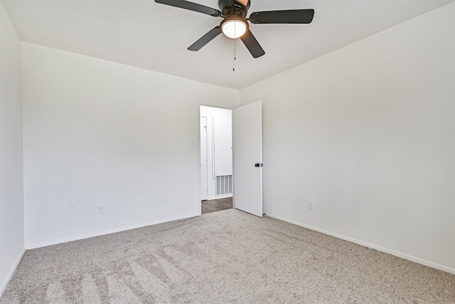 unfurnished room with ceiling fan and carpet flooring