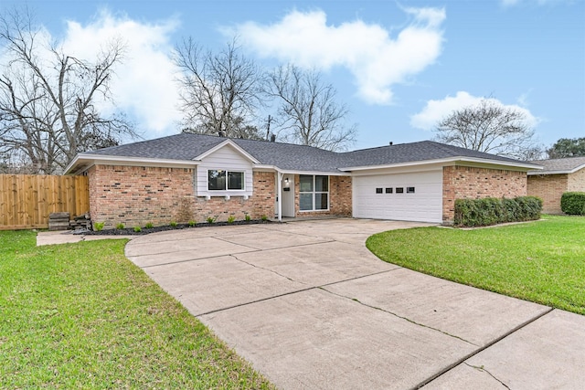 ranch-style house featuring a garage and a front yard