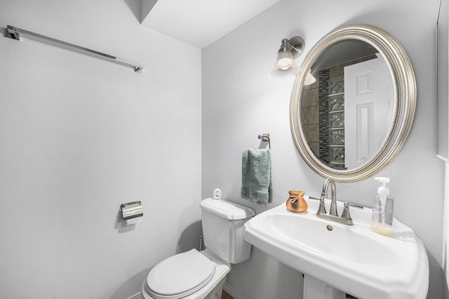 bathroom with sink and toilet