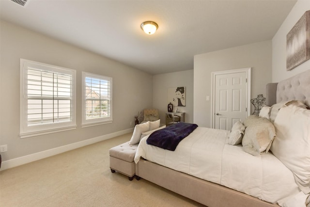 bedroom with light colored carpet