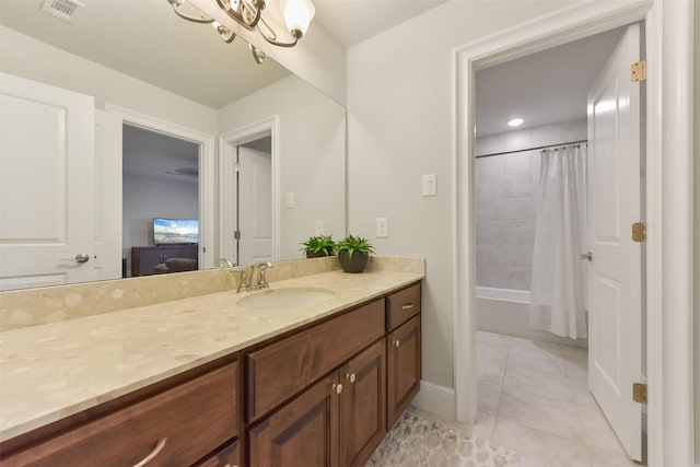 bathroom featuring vanity, tile patterned flooring, and shower / bath combo with shower curtain