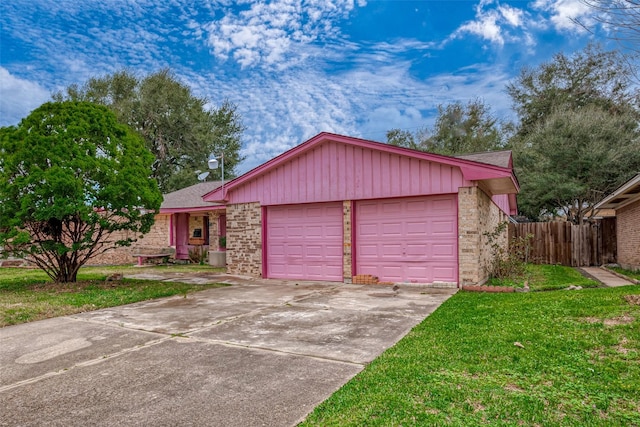 single story home featuring a garage and a front lawn