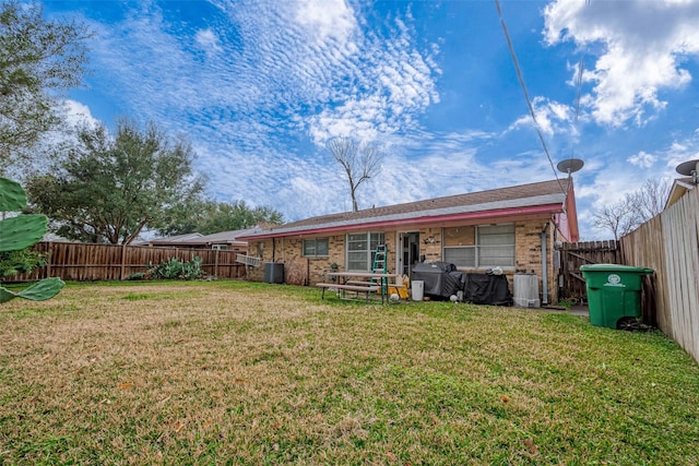 back of property with a yard