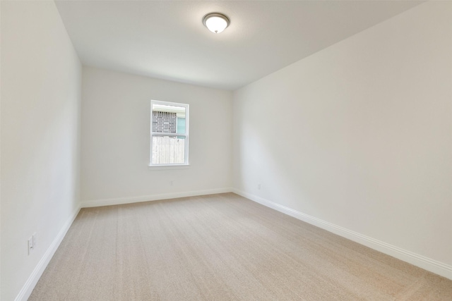 16119 Rustling Woods Rd, Conroe, TX 77302 - empty room with light carpet and baseboards