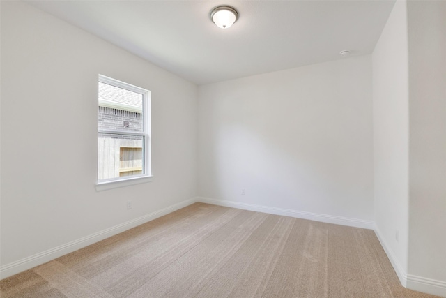 16119 Rustling Woods Rd, Conroe, TX 77302 - unfurnished room with light carpet and baseboards