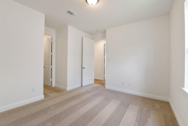16119 Rustling Woods Rd, Conroe, TX 77302 - unfurnished bedroom with light carpet and baseboards