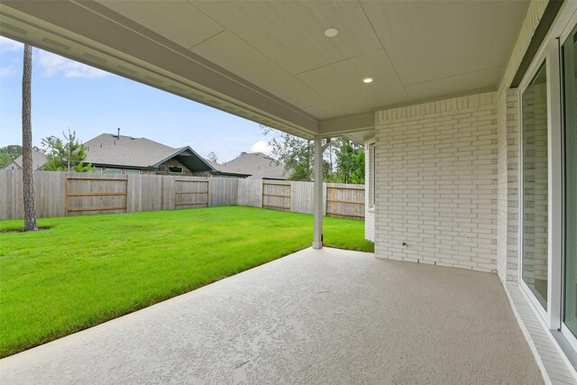 16119 Rustling Woods Rd, Conroe, TX 77302 - fenced backyard with a patio
