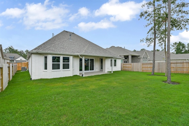 16119 Rustling Woods Rd, Conroe, TX 77302 - back of house with a fenced backyard, roof with shingles, a patio, and brick siding