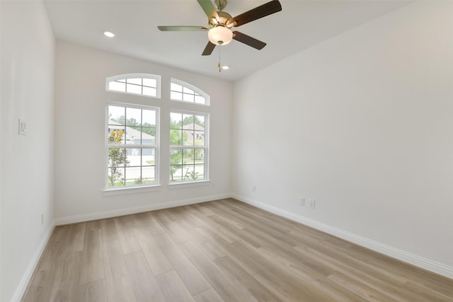 16119 Rustling Woods Rd, Conroe, TX 77302 - spare room featuring healthy amount of natural light, light wood-style floors, ceiling fan, and recessed lighting