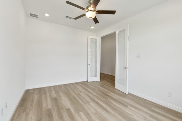 16119 Rustling Woods Rd, Conroe, TX 77302 - unfurnished room featuring french doors, light wood-type flooring, ceiling fan, and recessed lighting