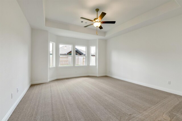 16119 Rustling Woods Rd, Conroe, TX 77302 - carpeted spare room with a raised ceiling and a ceiling fan