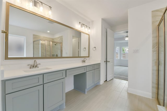 16119 Rustling Woods Rd, Conroe, TX 77302 - full bathroom with a shower stall, double vanity, and a ceiling fan