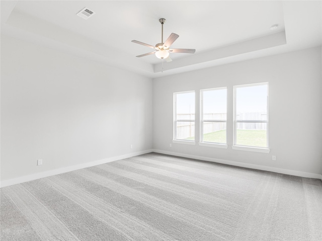 10903 Providence Ct, Missouri City, TX 77459 - carpeted empty room featuring a raised ceiling and a ceiling fan