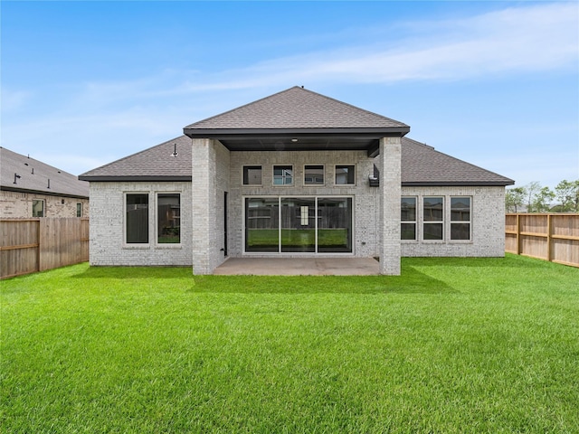 10903 Providence Ct, Missouri City, TX 77459 - rear view of property featuring a fenced backyard, a patio, roof with shingles, and brick siding