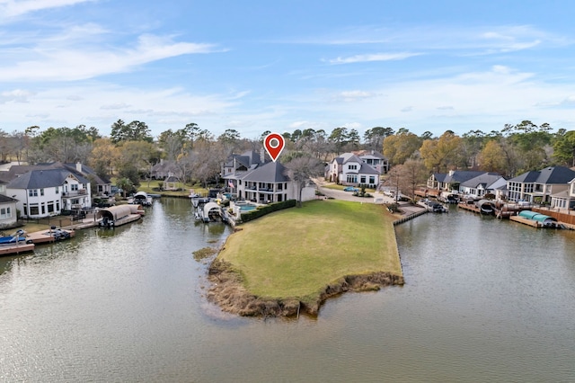 birds eye view of property featuring a water view