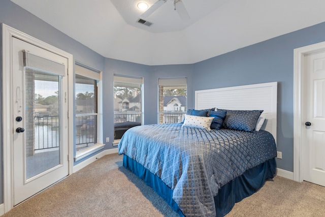 bedroom with access to outside, light colored carpet, and ceiling fan