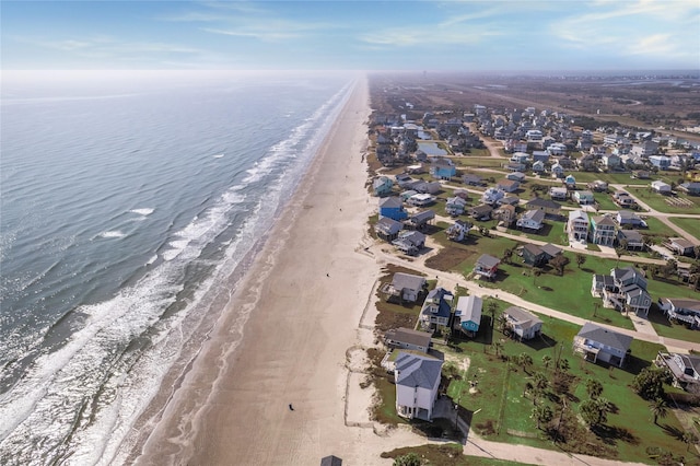 bird's eye view featuring a water view and a view of the beach